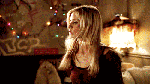 Buffy playing with a stake