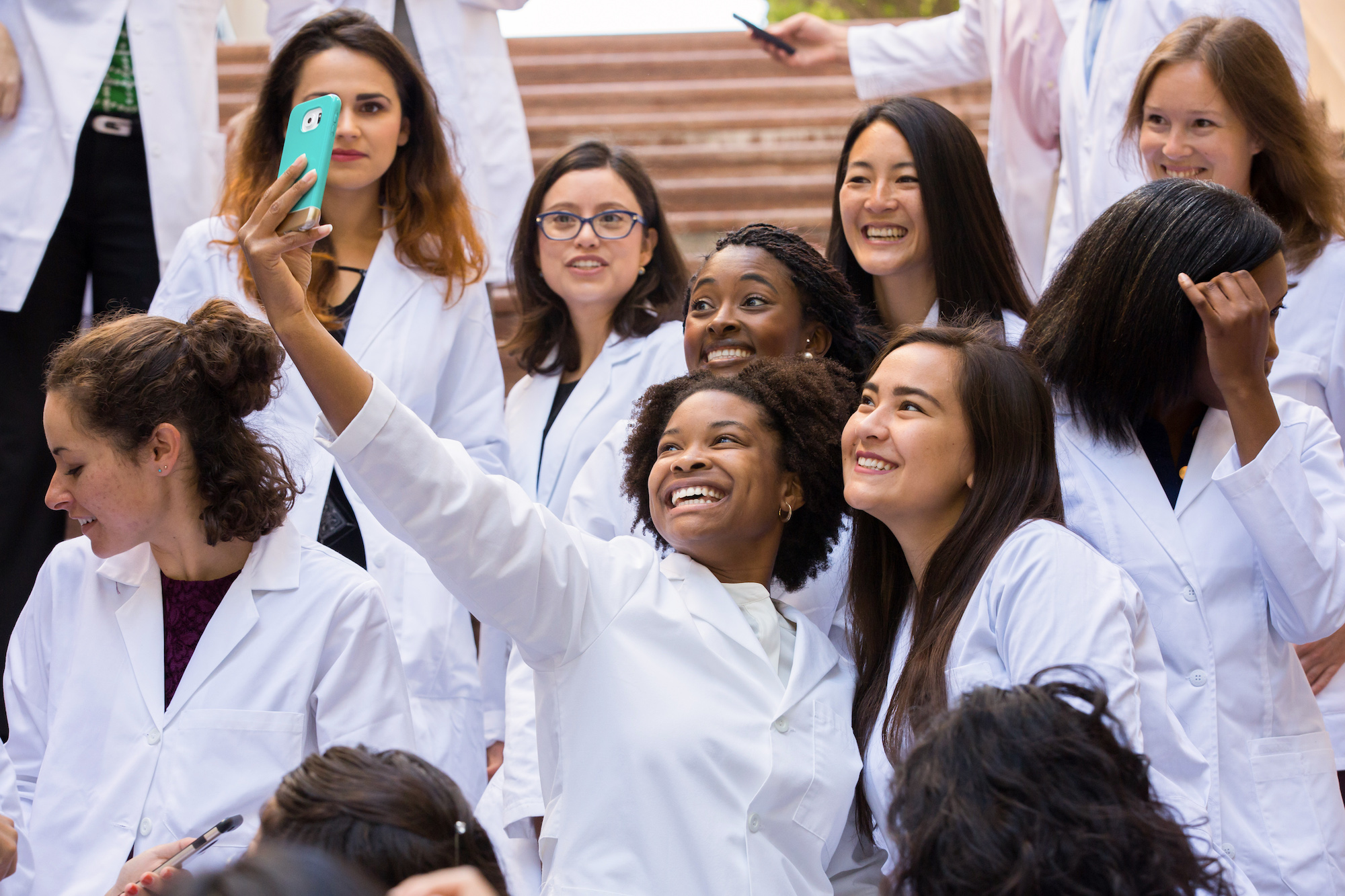 students getting their white coats