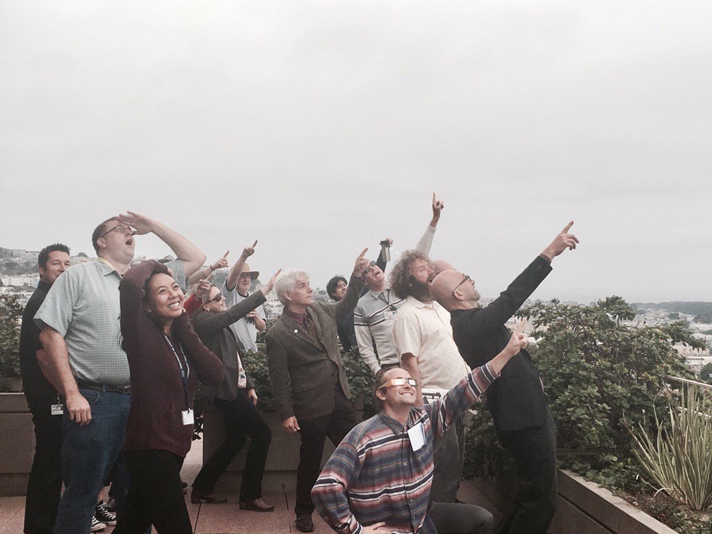 library staff watching an eclipse